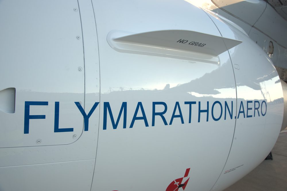 The engine of a Marathon Airlines Embraer carrying the flymarathon.aero titles