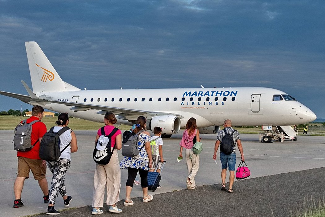 Passengers walking across an apron